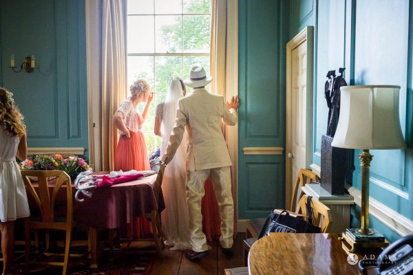 bridal party is looking at her guests over the window