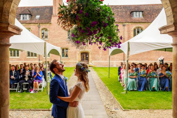 Happy couple about to kiss at their College Wedding in Cambridgeshire
