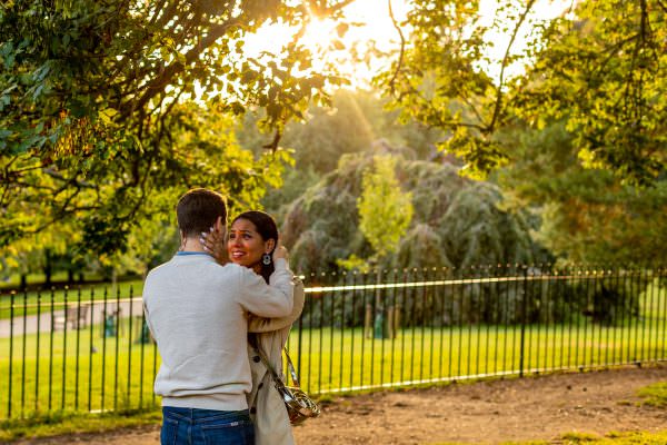 A romantic moment after the proposal of the couple hugging and looking in each other eyes with love