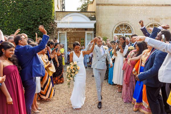 bride and groom enjoy confetti shower