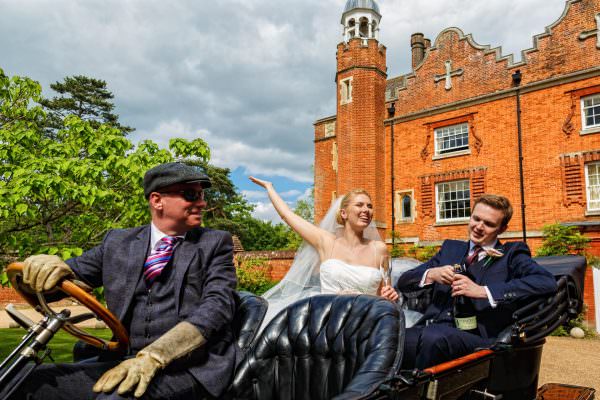 Bride and groom opening Champagne at they wedding