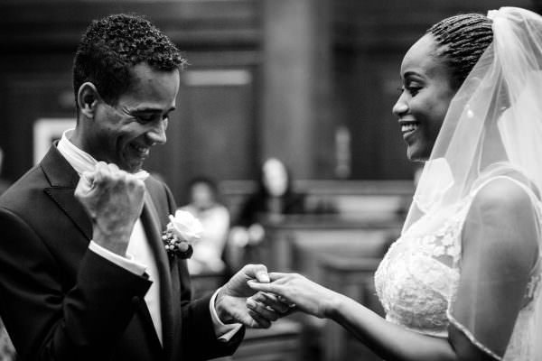Groom Excited raising his hand during a wedding ceremony in London