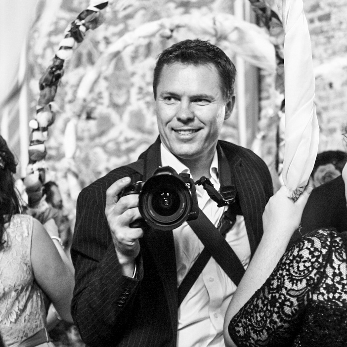 Adam with his camera shooting a wedding